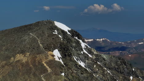 Aerial-cinematic-drone-early-morning-hiking-trail-Torreys-14er-Peaks-Parallax-Rocky-Mountains-Colorado-stunning-landscape-view-mid-summer-green-beautiful-snow-on-top-forward-movement