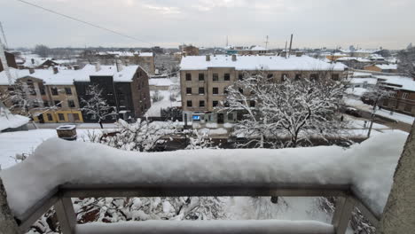 balcony view of snowy winter city in latvia