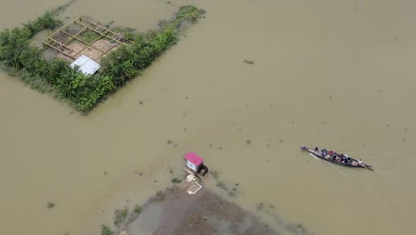 aerial view boat assistance arrival in flood affected bangladesh village submerged community crisis