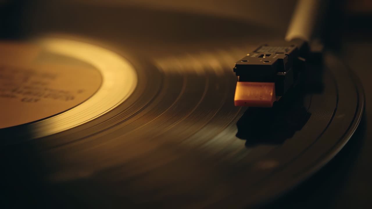 Descending stylus engaging rotating vinyl record on platter in living room, producing warm music