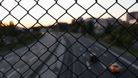 night traffic behind wire fence