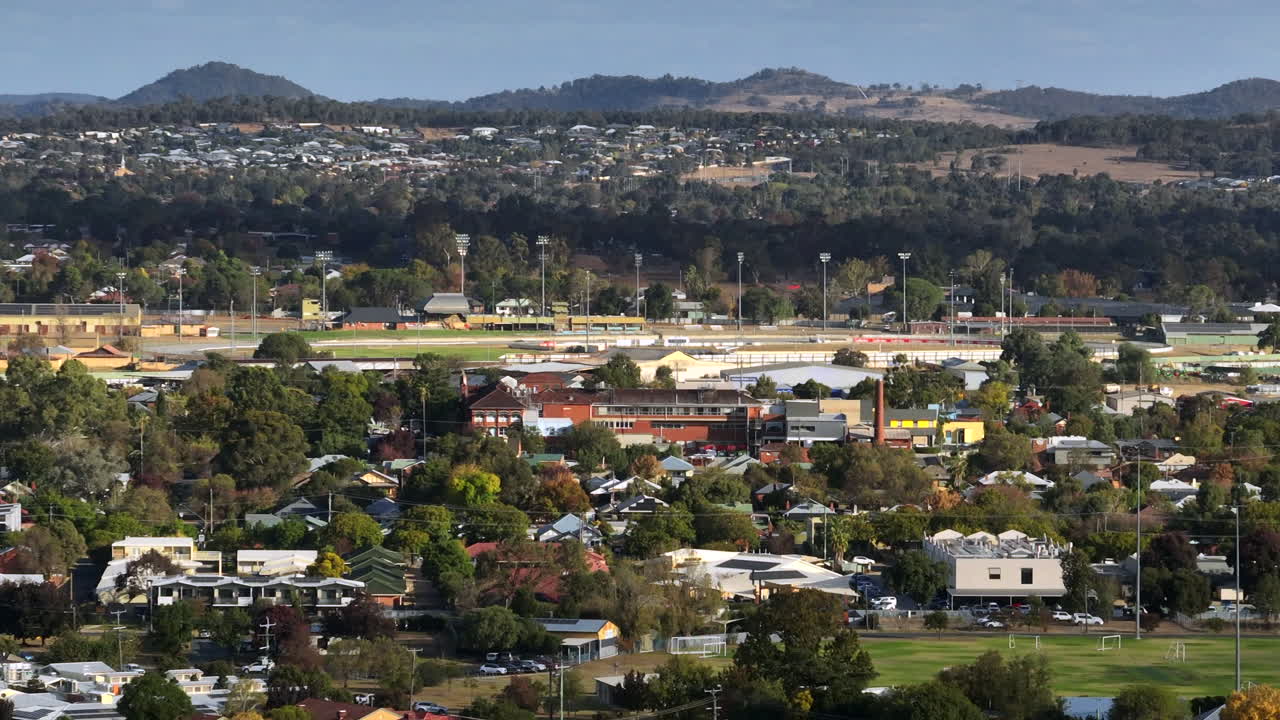 Aerial: Drone shot of houses and a sports field in Wagga Wagga, New South Wales, Australia.