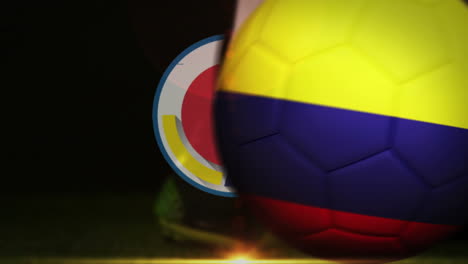 football player kicking colombia flag ball