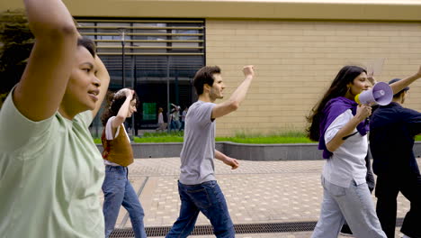 Side-View-Of-People-Walking-And-Shouting-At-The-Street