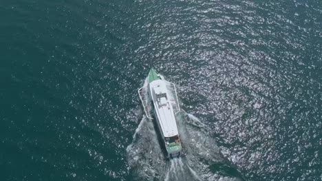 aerial view of public transportation ferry travelling on the lake garda in riva del garda, a small town and commune in the italian province of trento at the northern tip of the lake