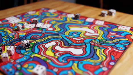 colorful board game with dice and game pieces