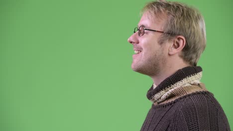 profile view of blonde handsome man ready for winter