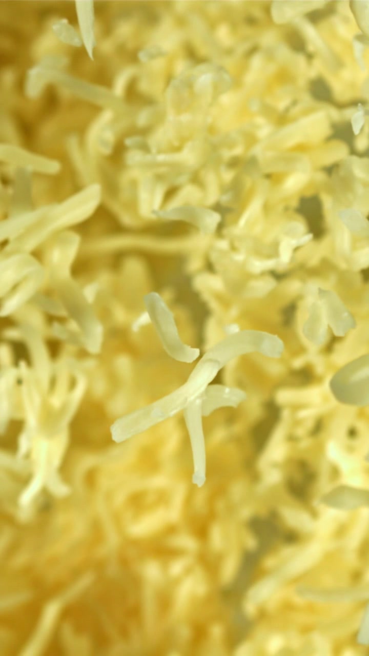 Shredded Cheese Falling in Slow Motion