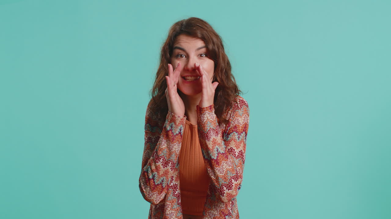 Young woman whisper news rumors holding hands near mouth share gossip quiet keep my secrets