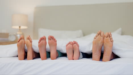 sleeping, feet and family in a bed relax