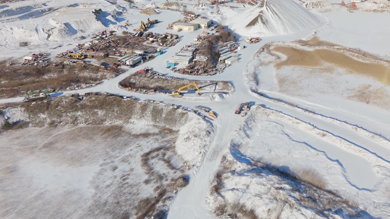 James dick quarry in caledon village covered in snow, with machinery visible, aerial view