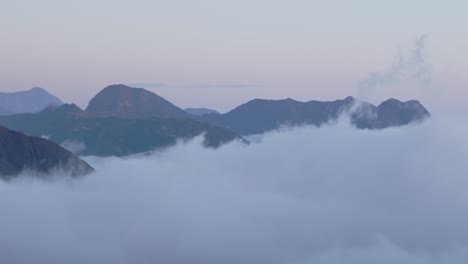 cloud cover below mountains pan left, cajamarca 4k