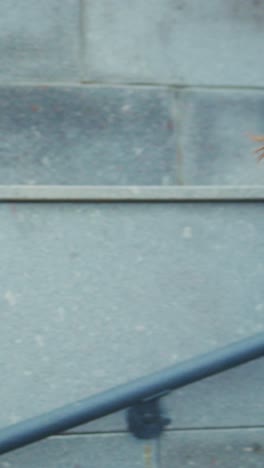a young woman in athletic wear enjoys her outdoor run while listening to music through wireless headphones on a gloomy day