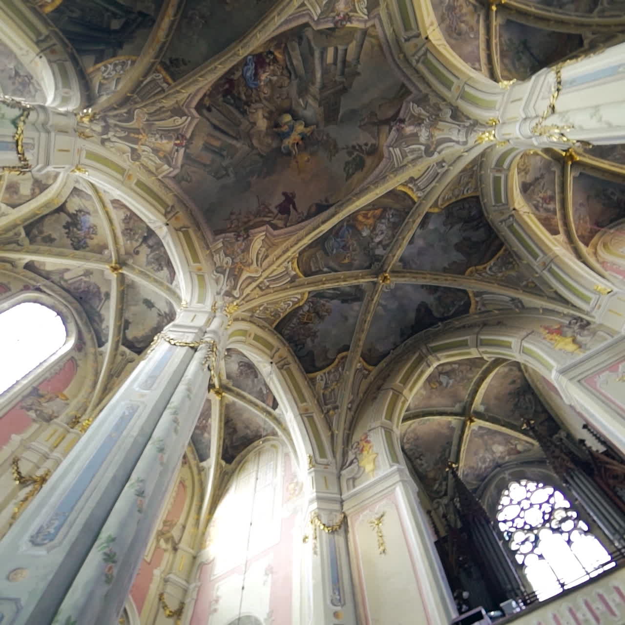 Magnificent ceiling and dome of the cathedral of the Assumption Blessed Virgin Mary inside. The interior of Catholic church. Camera moves around.