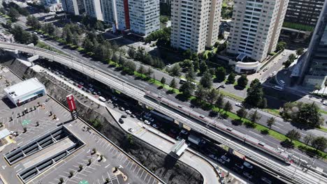 Drone footage showcasing a train arriving at modern Santa Fe station, CDMX