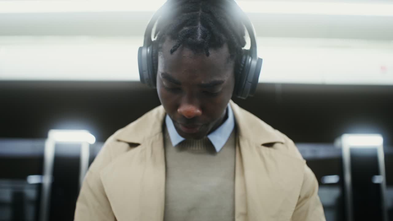 Man with Headphones in Subway