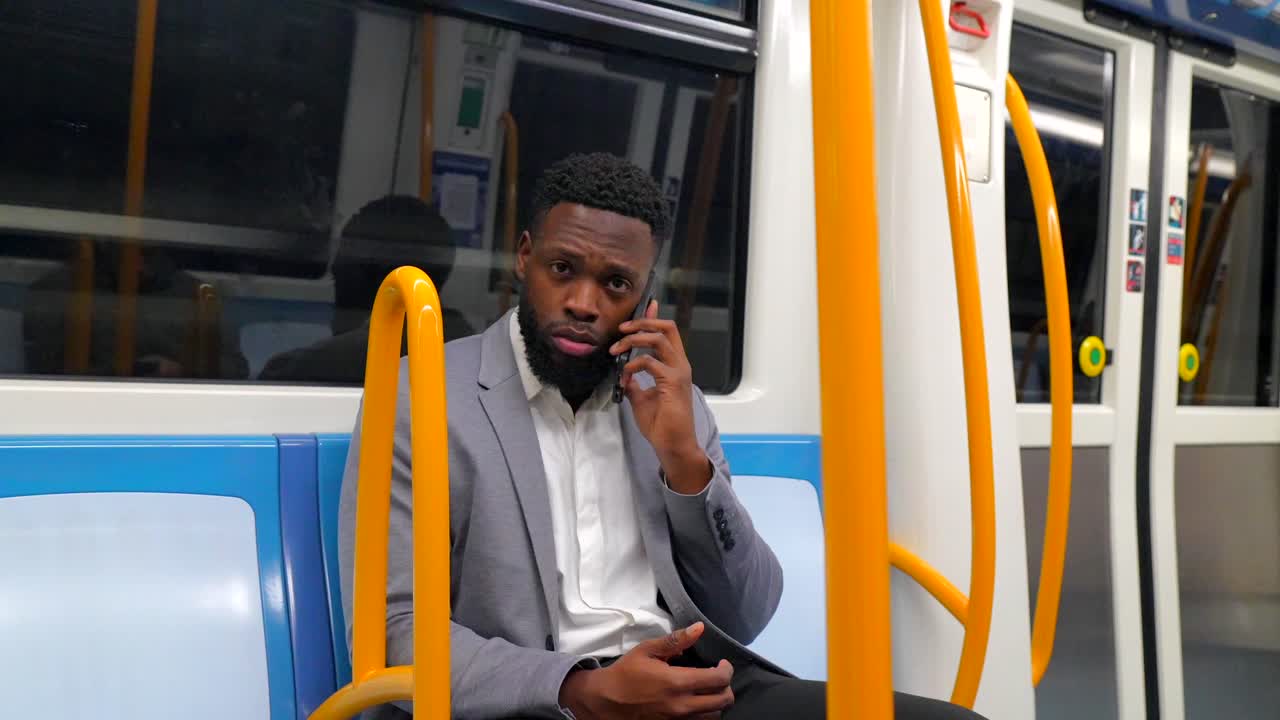 Man in a suit on a subway train