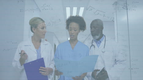 healthcare colleagues reviewing patient data in bright corridor, with floating math symbols overlay