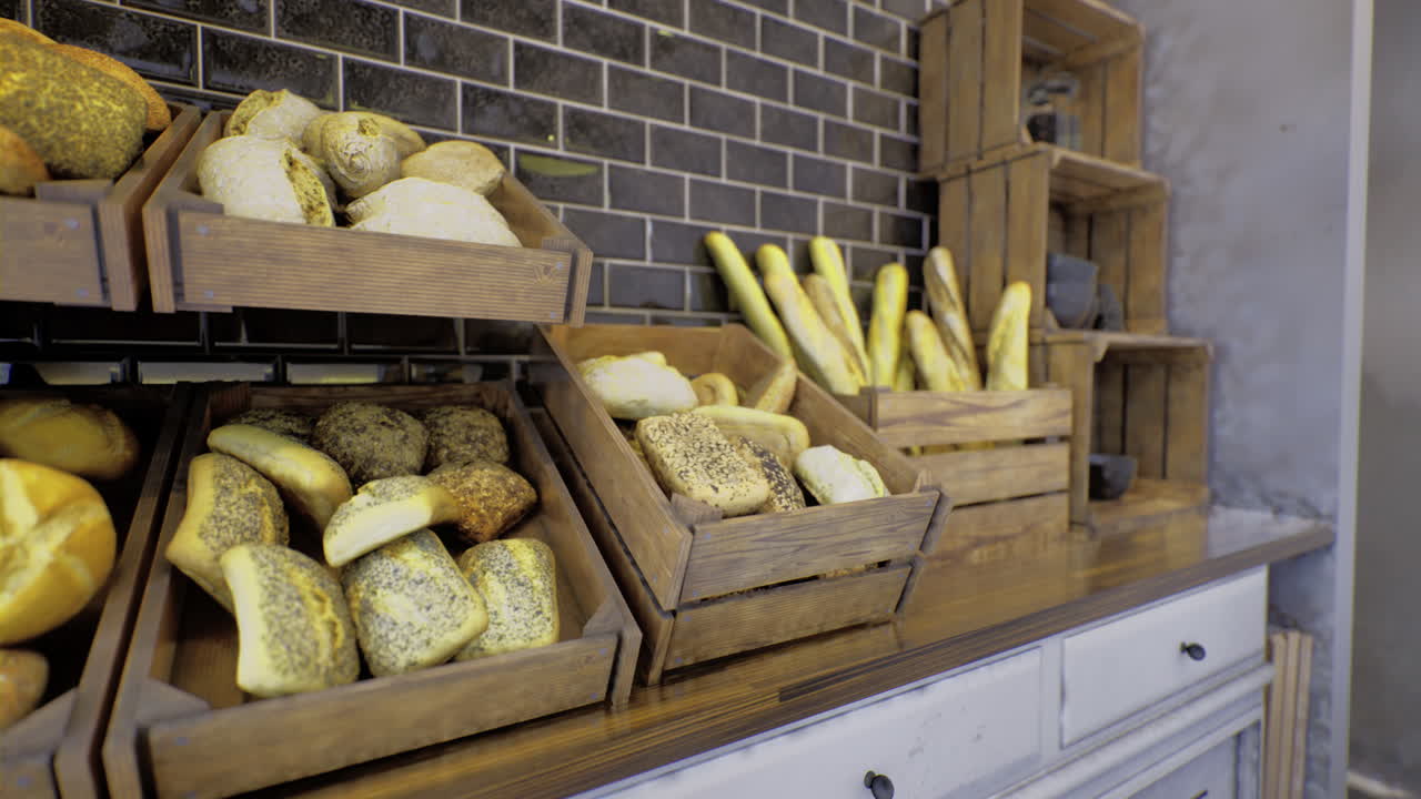 Fresh artisanal bread displayed in rustic wooden crates at local bakery