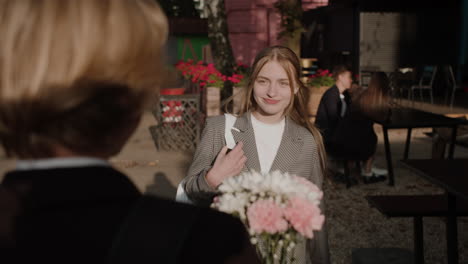 boy giving flowers to girl