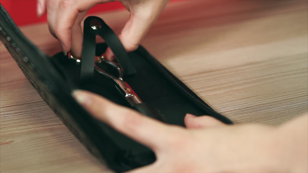 Putting Hair Scissors in a Black Case