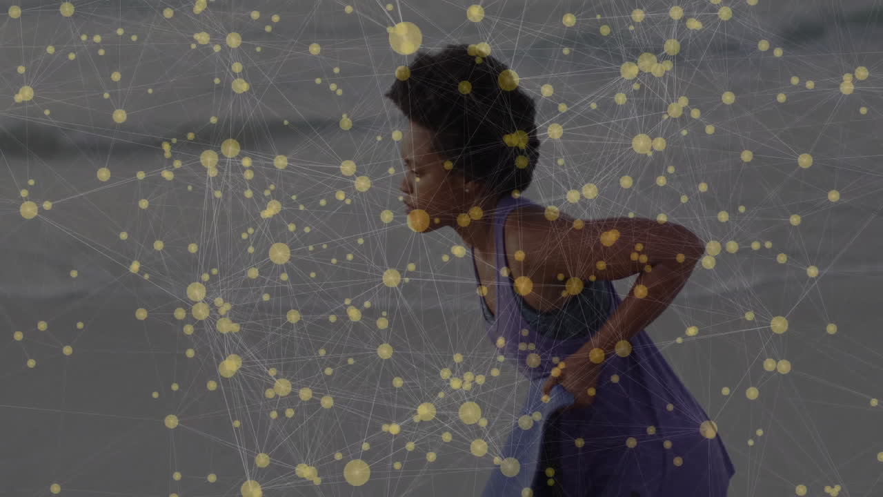 Exercising on beach, woman with animation of network connections and yellow dots