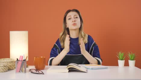 Young-woman-apologizing-looking-at-camera.