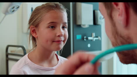 Pediatric-Doctor-Examining-Girl-In-Surgery