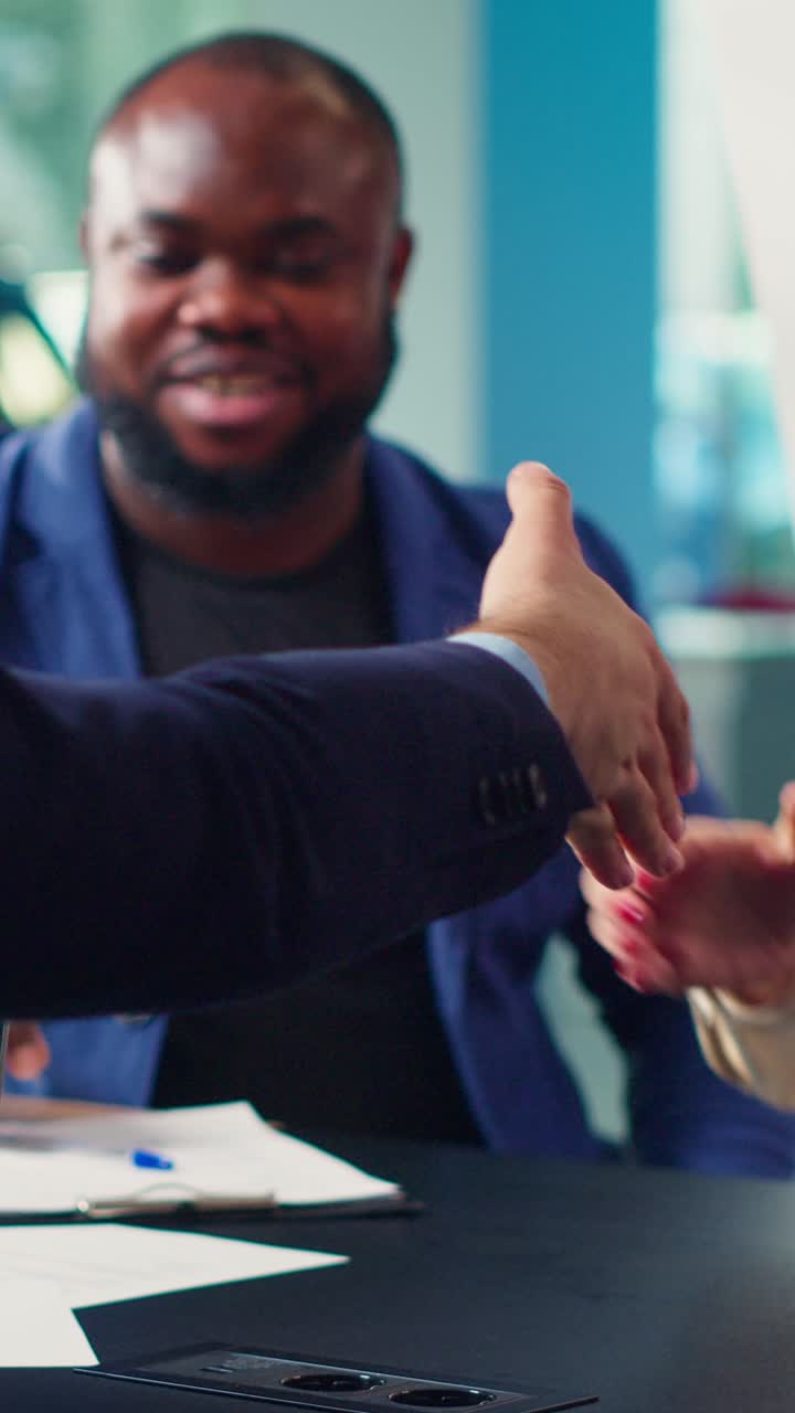 Business People Shaking Hands in Office Meeting