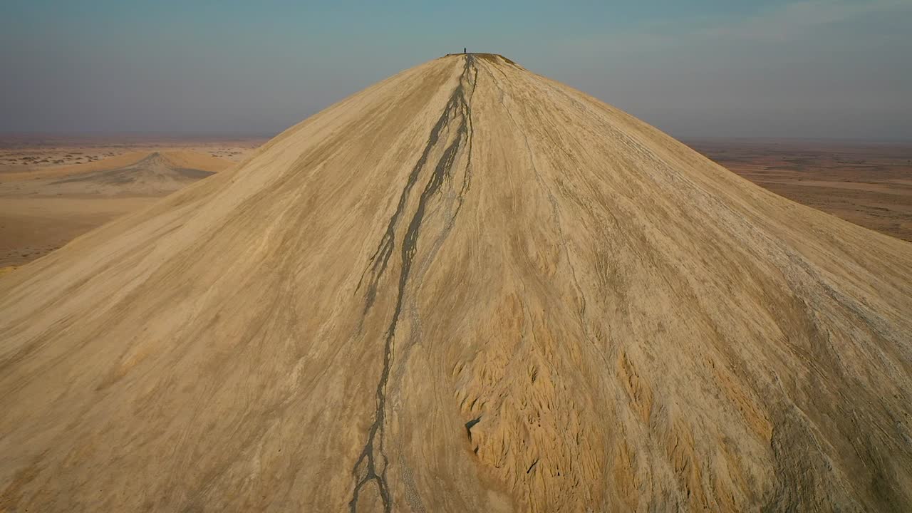 Active Volcano in Pakistan drone shot with DJI Mavic Pro 2. Person flying drove in mud volcano, climbed to top.
