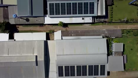 Aerial-View-of-Large-Scale-Solar-Panels-on-Modern-Factory-Roof