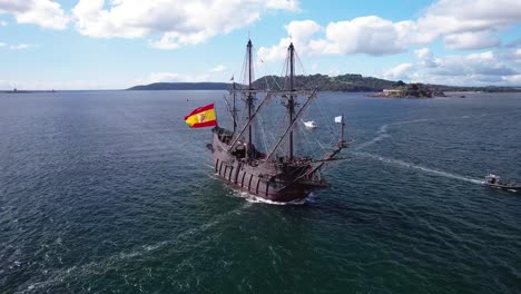 el galeón andalucía sails into plymouth sound city harbor, aerial drone shot