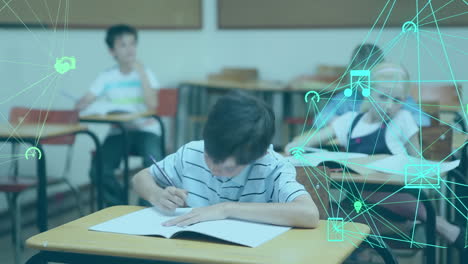 animation of globe of digital icons against caucasian boy studying in the class at school