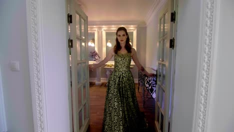 woman in a golden gown in a grand interior