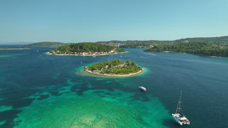 luxury yachs anchored in shallow water at korcula islands in croatia on a sunny day