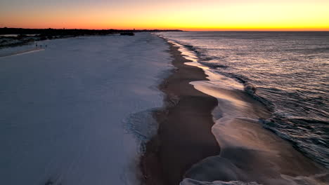 snow covered beach at sunrise