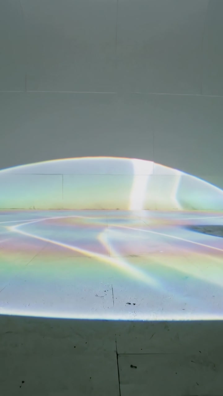 Vertical video: Light starting, dome light shifting rainbow bands and vertical flare for studio art