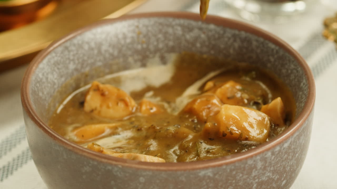 Delicious chicken soup with herbs, a classic, hearty dish, perfect for a comforting meal with a savory aroma