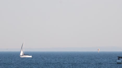 a sailboat glides across the ocean