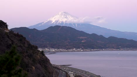 beautiful pink and purple sky with mount fuji and ocean - high above view