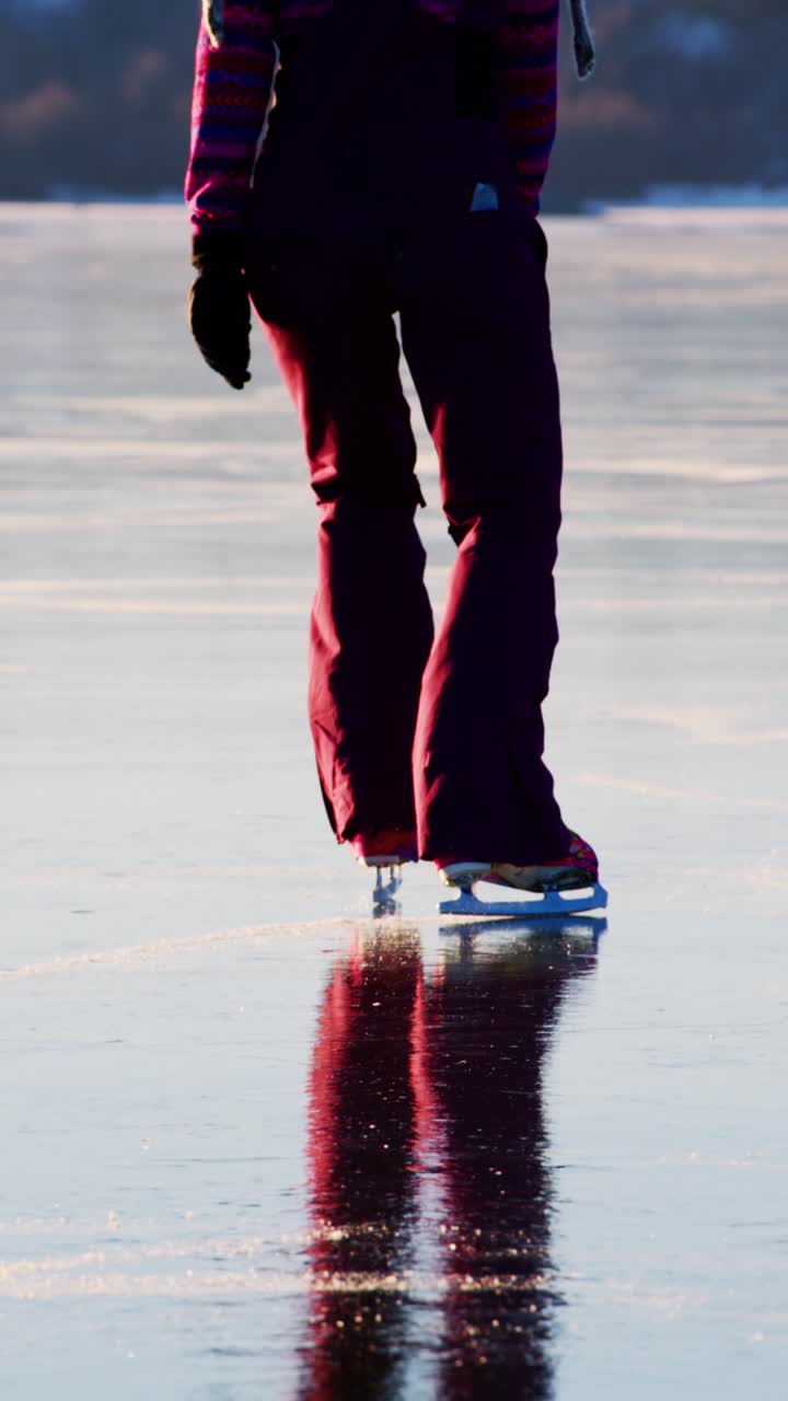 A graceful figure gliding across the shimmering ice, showcasing the elegance of skating as the golden light reflects off the surface, illuminating the beauty of winter activities and the joy of motion