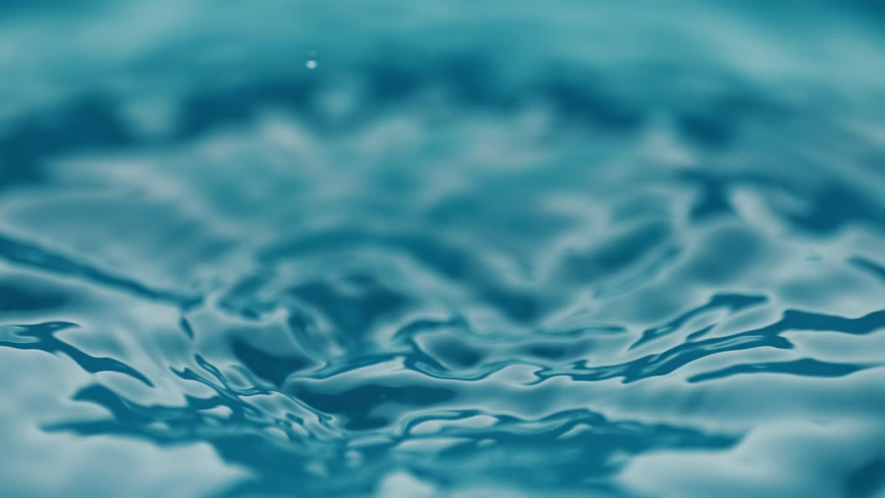 Drop close-up of water falls in a super slow motion.