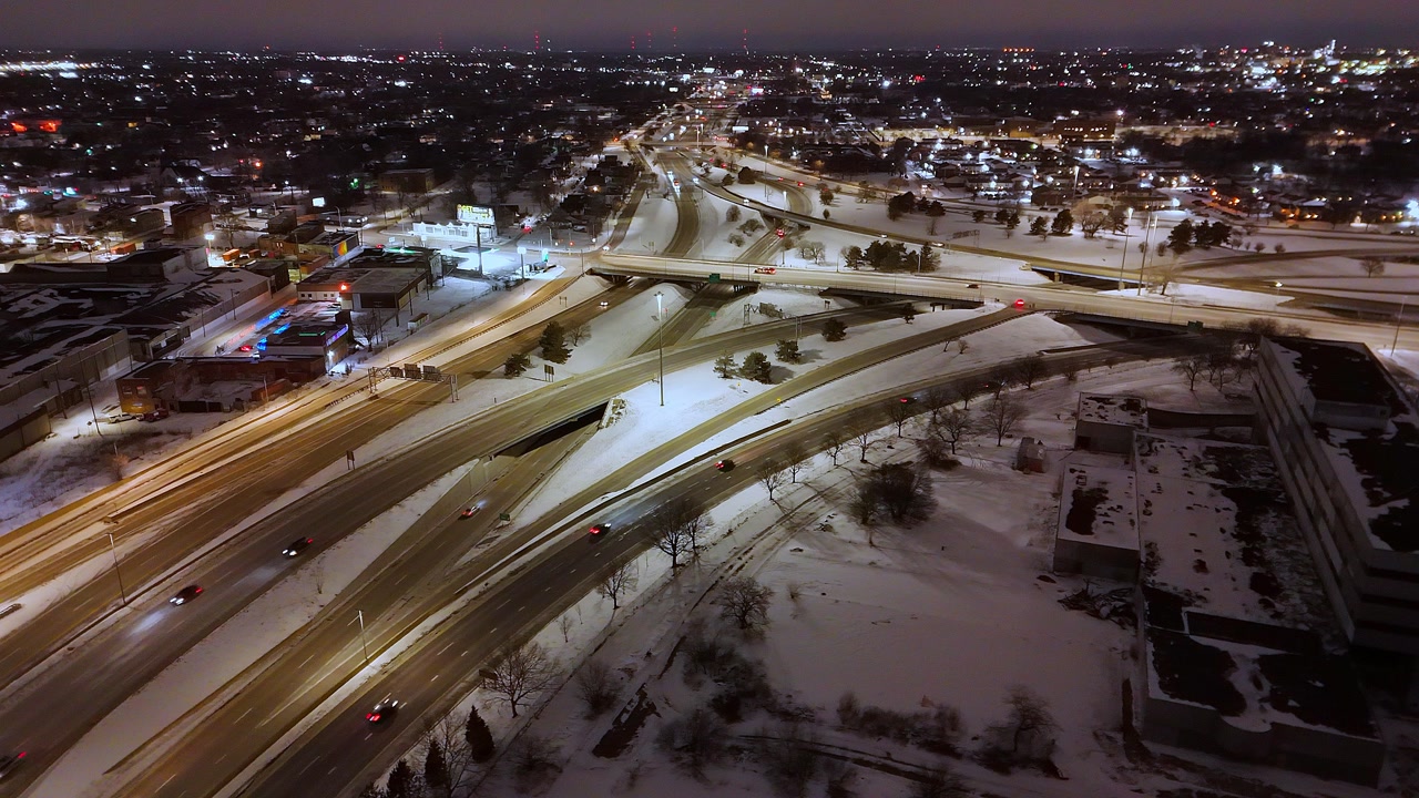 Detroit, Michigan Interstate 75 and 96 at night in aerial winter shot, USA