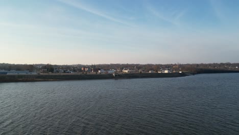 Flying-over-the-Mississippi-River-from-Fulton,-Illinois-to-Clinton,-Iowa-on-a-crisp-December-day