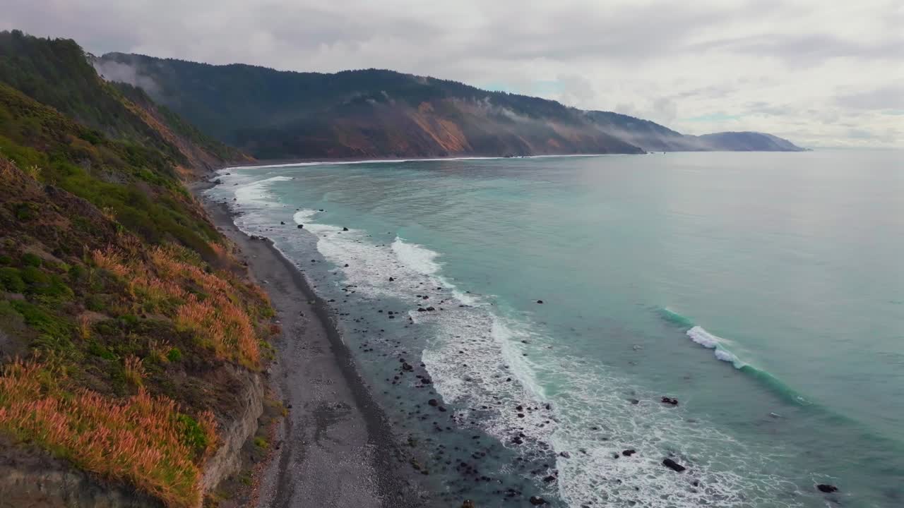USAL Beach vibrant Pacific Ocean landscape scene Sinkyone Wilderness Lost Coast Trail California aerial drone rugged untouched coastline rain mist morning remote untouched waves crashing forward pan