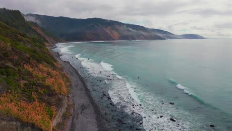 usal beach vibrant pacific ocean landscape scene sinkyone wilderness lost coast trail california aerial drone rugged untouched coastline rain mist morning remote untouched waves crashing forward pan