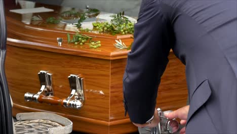 closeup-shot-of-a-funeral-casket-in-a-hearse-or-chapel-or-burial-at-cemetery