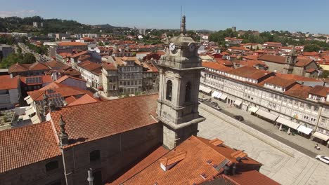 drone flying over peter's church in guimaraes