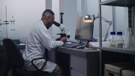 scientist working with microscope in a laboratory