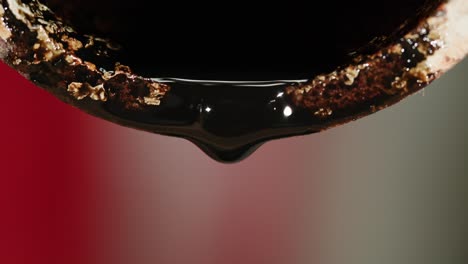 leaking dark oil from rusty pipe